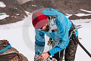 Man climber packing backpack mountains alpinism