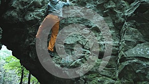 Man climbing bouldering route on the cliff