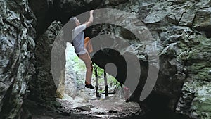 Man climbing bouldering route on the cliff