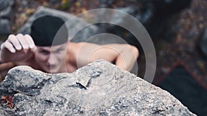 Man climbing on cliffed rock belay