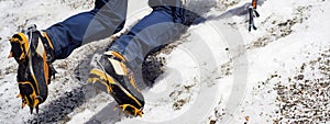 Man is climbing with crampons on the glacier.