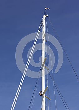 Man climbing a high mast