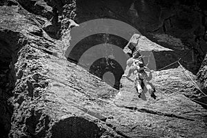 Man climbing high mountain