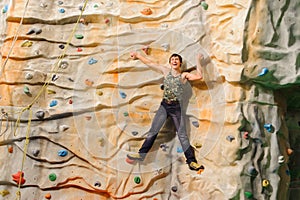 Man climbing on man-made cliff