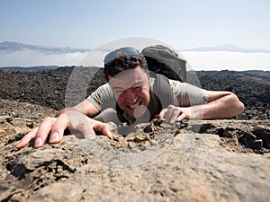 Man climbing a mountain