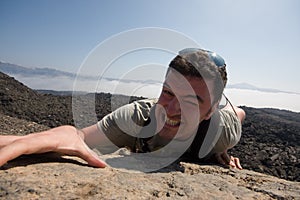 Man climbing a mountain