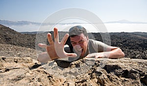 Man climbing a mountain