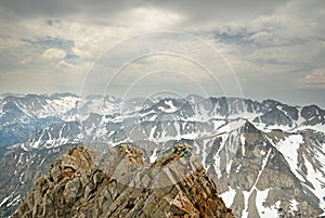 Man Climbing Mountain Ridge