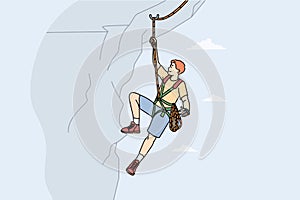 Man climbing mountain with special equipment