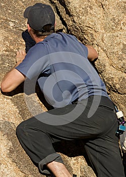 Man climbing a rock