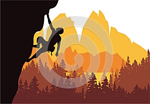 Man climbing rock overhang. Mountains and forest in the background. Silhouette of climber with brown, orange and yellow background