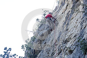 Man is climbing on a rock wall