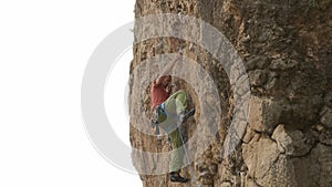 A man is climbing a rock wall