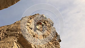 A man is climbing a rock wall