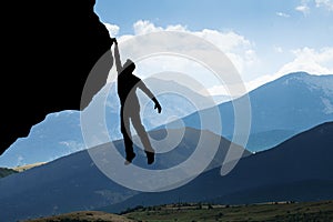Man Climbing On Rocky Mountain