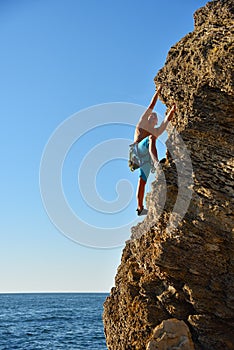 Man climbing up on mountain