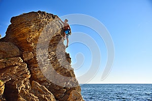 Man climbing up on mountain