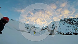 Man Climbing Up Snowy Mountain Ice Axe and Crampons