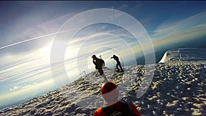 Man Climbing Up Snowy Mountain Ice Axe and Crampons