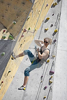 Man climbing up the wall