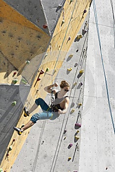 Man climbing up the wall