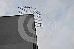 Man climbs the wall of the building. uses a lightning conductor as a rope. robbery or overcoming the balcony risk of falling and b