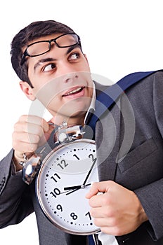 Man with clock afraid to miss deadline