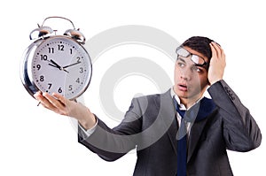 Man with clock afraid to miss deadline