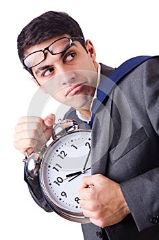 Man with clock afraid to miss deadline isolated