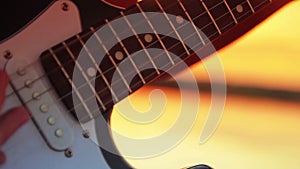 Man close-up electric guitar playing rock at