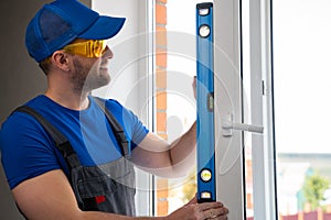 Man closes window for checking satisfactory state of handle