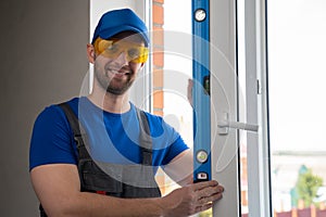 Man closes window for checking satisfactory state of handle