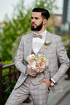 Man Clothed Stylish Suit Holding Bouquet of Flower