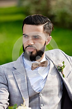 Man Clothed Stylish Suit Holding Bouquet of Flower