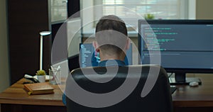 Man coding html and programming on two screen Monitors, development web, developer.