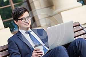 Man with coffee and laptop