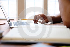 Man college student  studying learning lesson with computer online photo