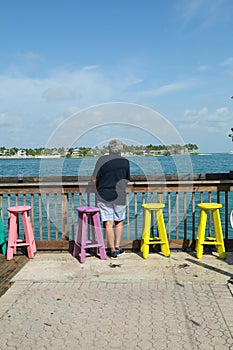 Man colorful stools Atlantic Ocean Key West summer