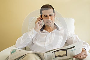 Man commenting economy news by a cellphone