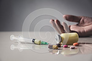 The man committing suicide by overdosing on medication. Close up photo