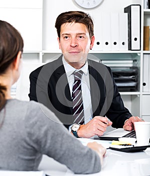 Man with companion sitting at the table