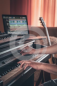 A man composer, producer, arranger, songwriter, musician hands arranging music. photo