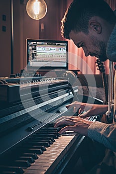 A man composer, producer, arranger, songwriter, musician hands arranging music. photo