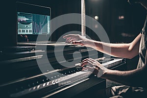 A man composer, producer, arranger, songwriter, musician hands arranging music. photo