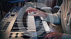 A man composer, producer, arranger, songwriter, musician hands arranging music. photo