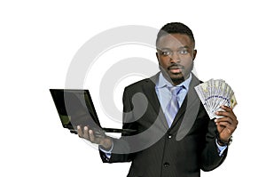 Man with computer and cash photo
