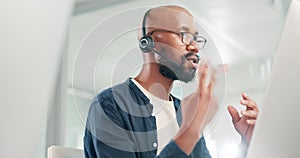 Man, computer and communication for customer care, helpdesk and operator in office. Black male person, call centre