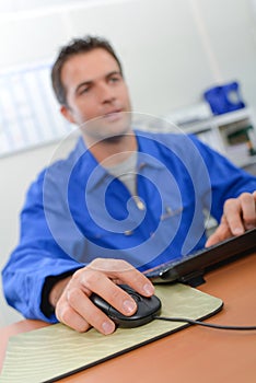 Man on computer hand on mouse