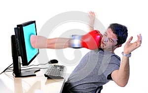 Man with computer hit by boxing glove