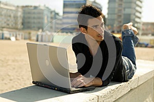 Man with computer working outd